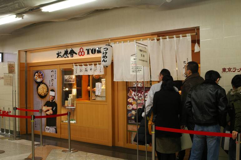 One of the many ramen stores in Tokyo Ramen Street. You might have to queue - it's a popular place! Pic by lazy fri13th, used under a Creative Commons licence.