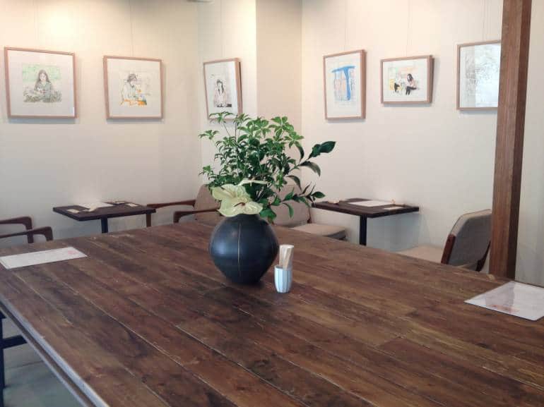 The main dining area featuring monthly exhibitions from local artists.