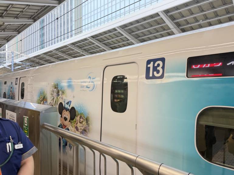Sparkling Dreams Shinkansen in Jubilee Blue livery at a station platform