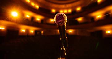 microphone on the empty stage with spotlights for design purpose