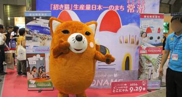 Visitors at a regional tourism booth at Tourism EXPO Japan, Tokyo Big Sight