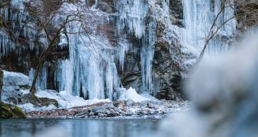 Icy mountain with icicles make from waterfall.