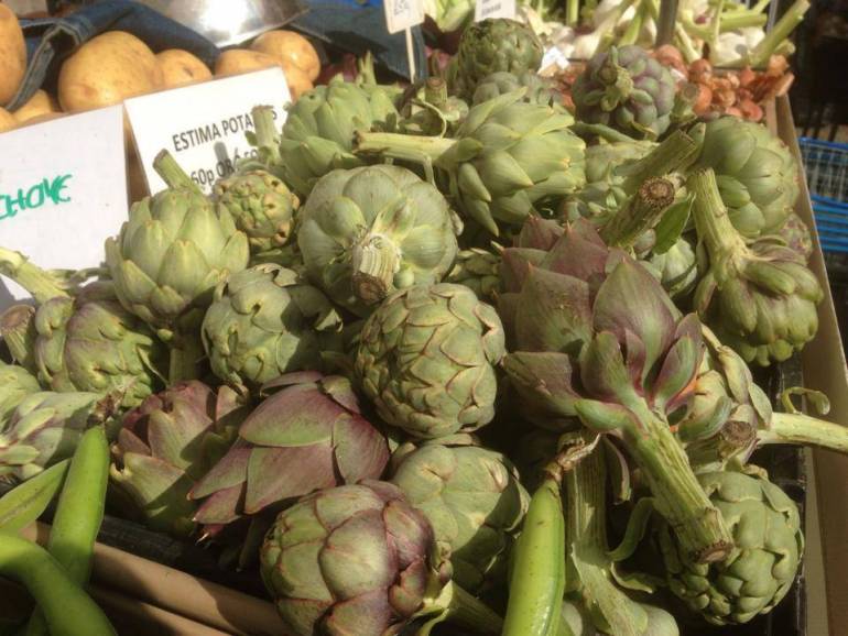 A box of fresh vegetables on display