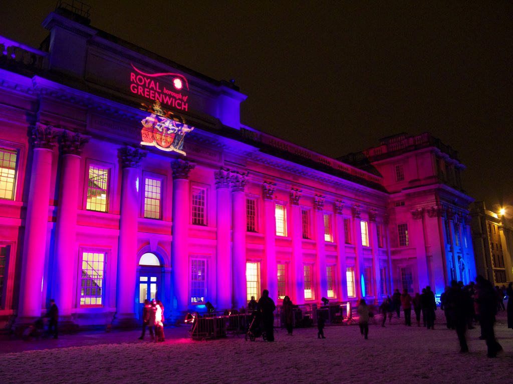 The Old Naval College in Greenwich lit up at night.