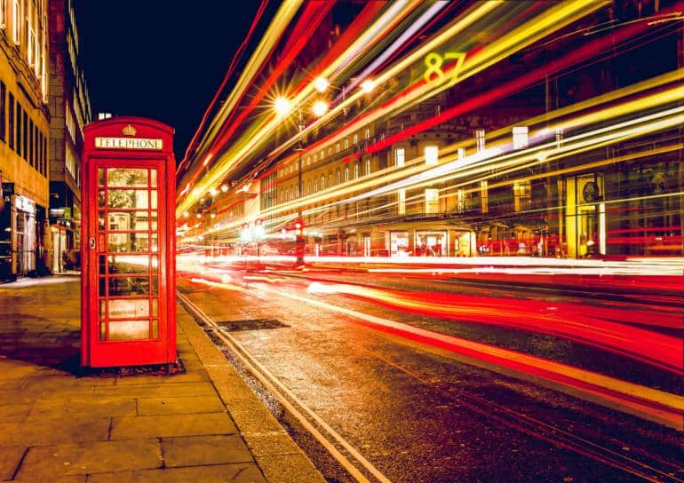a red telephone booth on a London street to introduce UK SIM cards