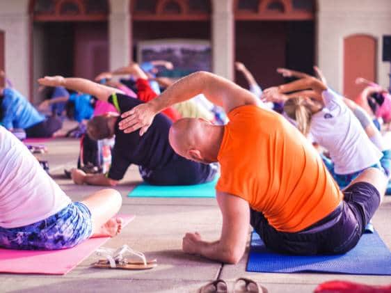 A group of people practicing Yoga