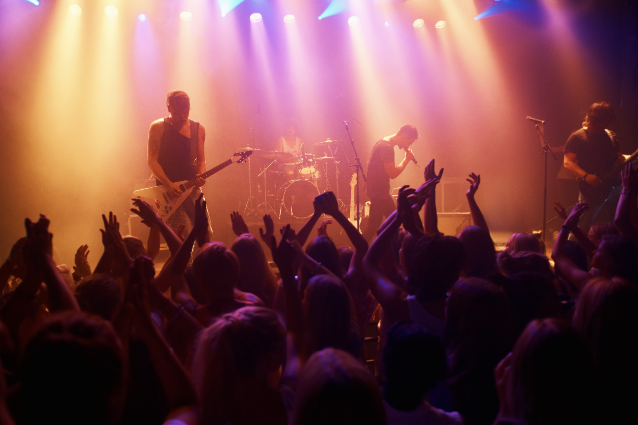 A band playing their hearts out at a festival show.